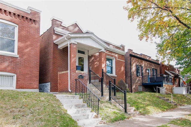 view of property with brick siding