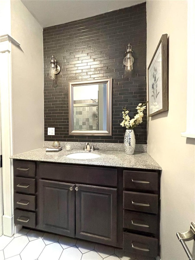 bathroom featuring tile patterned flooring and vanity