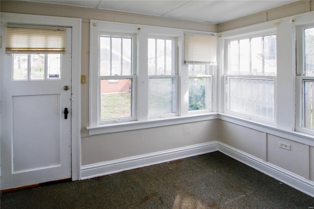 unfurnished sunroom featuring plenty of natural light