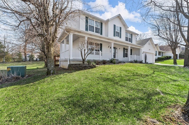 view of front facade featuring a front yard, a garage, covered porch, and central AC