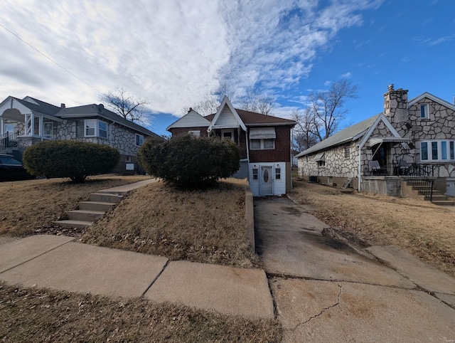 view of front of home featuring brick siding