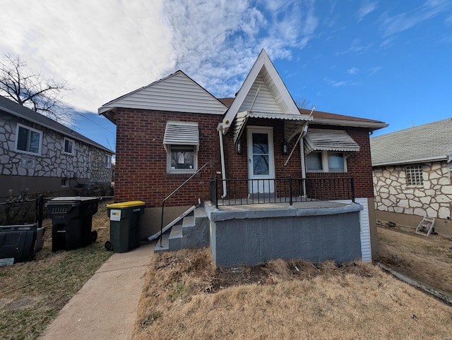 view of front of house with brick siding