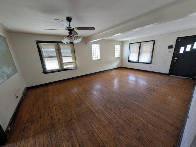 interior space with baseboards, ceiling fan, and hardwood / wood-style flooring