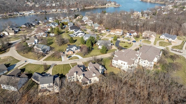 drone / aerial view featuring a residential view and a water view