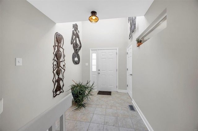 foyer with visible vents and baseboards