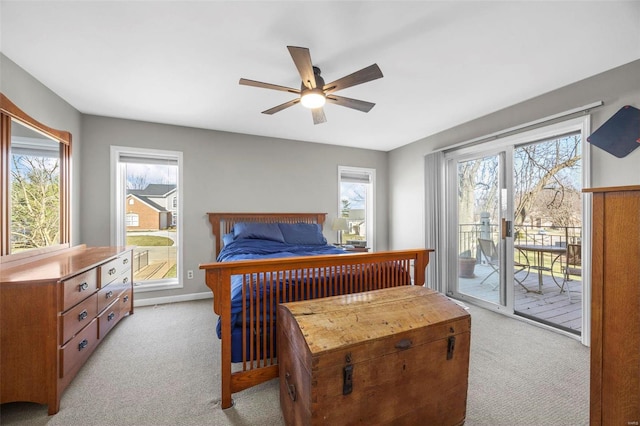 bedroom with ceiling fan, baseboards, light colored carpet, and access to exterior