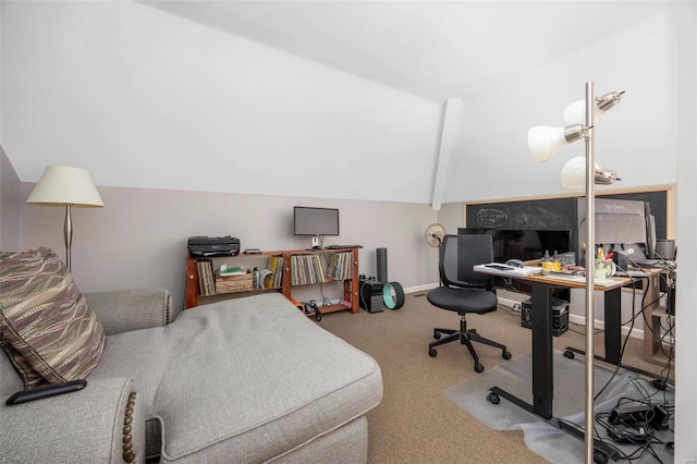 carpeted home office with baseboards and lofted ceiling