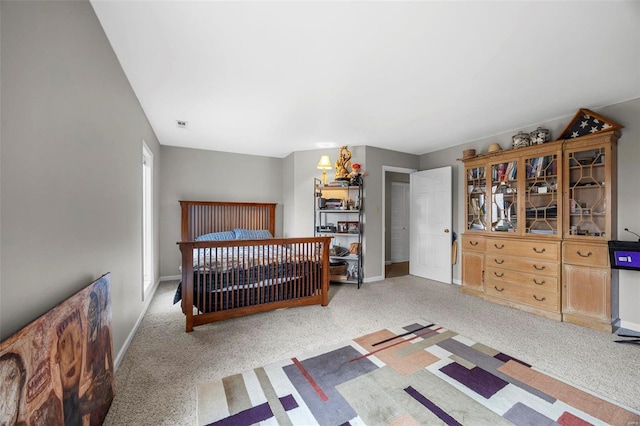 bedroom with visible vents, baseboards, and carpet