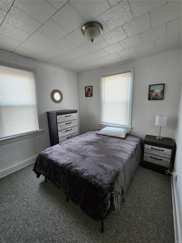 bedroom with carpet flooring and baseboards