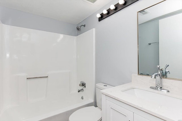 bathroom featuring vanity, toilet, and washtub / shower combination