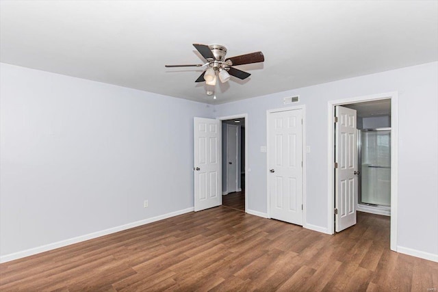 unfurnished bedroom with visible vents, ceiling fan, baseboards, and wood finished floors