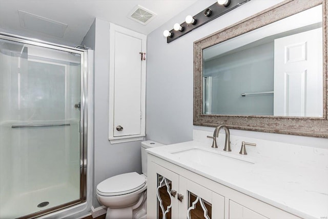 full bath with visible vents, a shower stall, toilet, and vanity