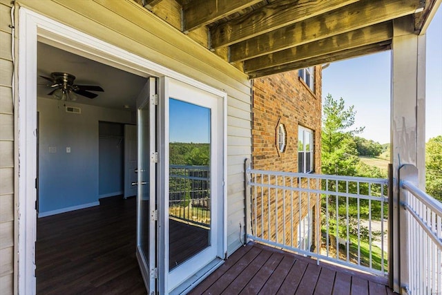 wooden terrace featuring visible vents