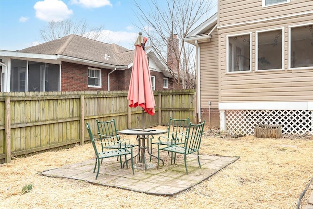 view of patio featuring fence