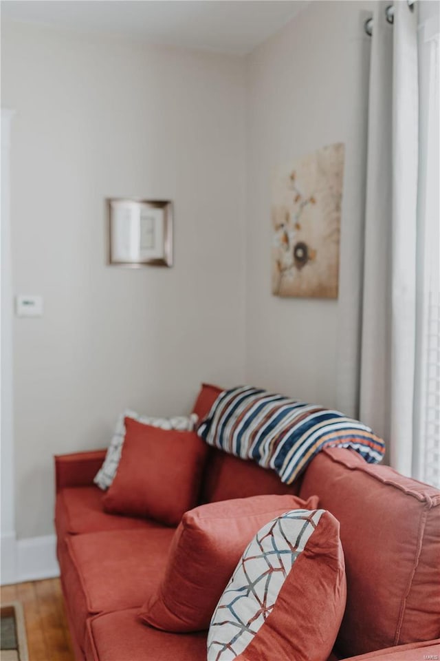 living room featuring baseboards and wood finished floors