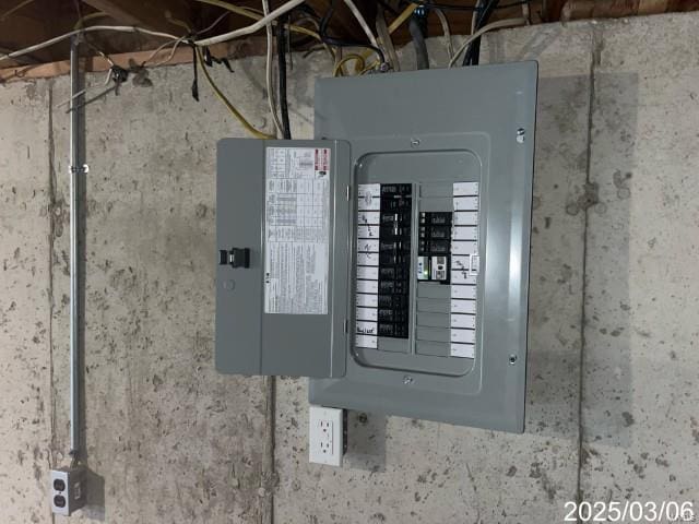 utility room with electric panel