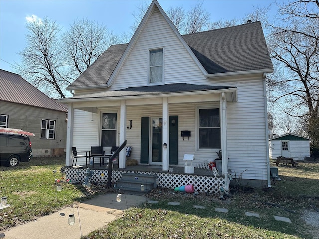 view of front of house featuring a porch and roof with shingles