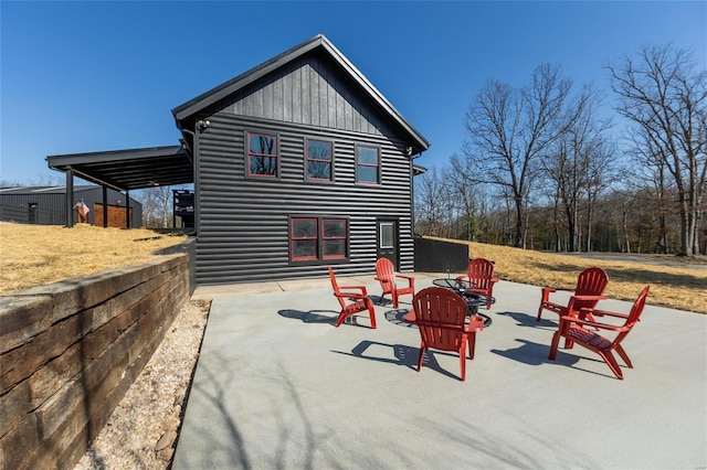 exterior space featuring a patio area and an outdoor fire pit