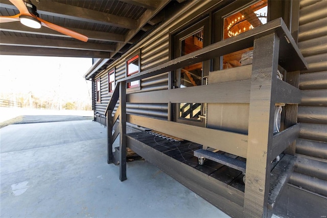 exterior space with faux log siding and an exterior structure