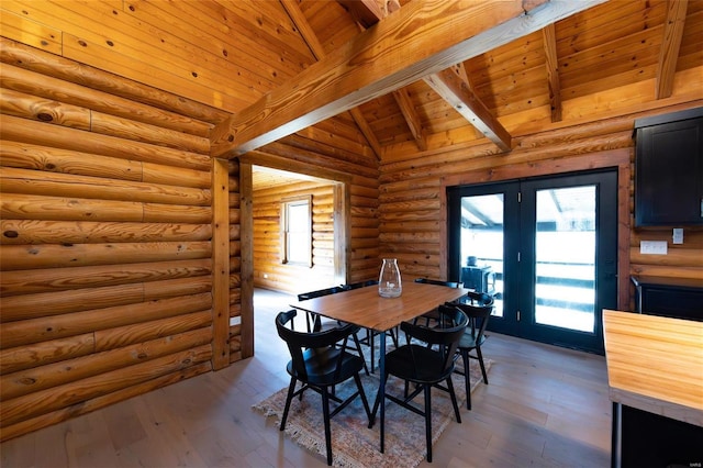 dining space featuring wood ceiling, lofted ceiling with beams, light wood-style flooring, french doors, and log walls