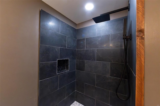 full bathroom with tiled shower