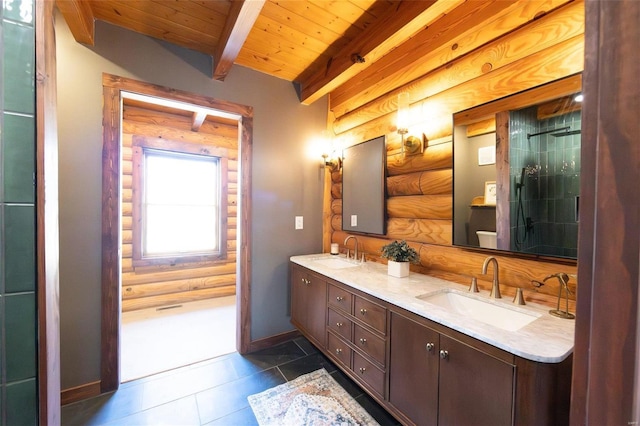 full bath featuring rustic walls, beam ceiling, tile patterned floors, and a sink