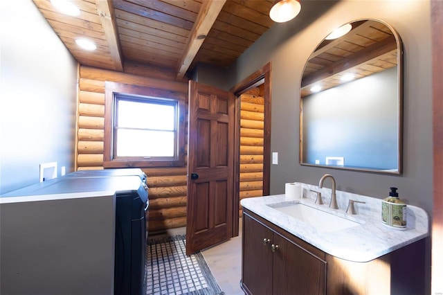 bathroom featuring beamed ceiling, wood ceiling, and vanity