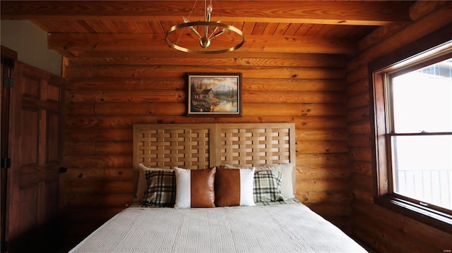 bedroom featuring wood ceiling and rustic walls