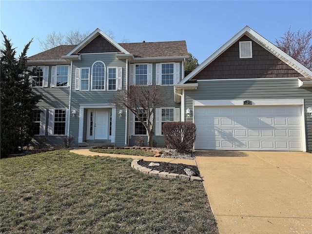 colonial-style house featuring a garage, concrete driveway, and a front lawn