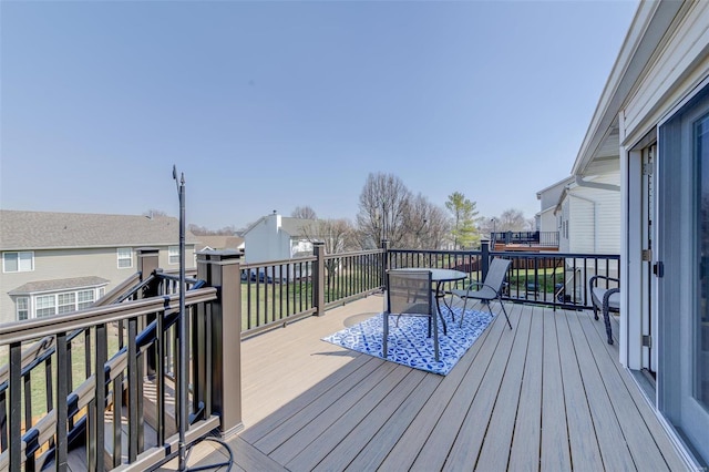 wooden terrace featuring a residential view