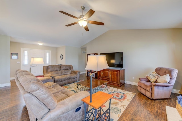 living room featuring vaulted ceiling, baseboards, a ceiling fan, and wood finished floors