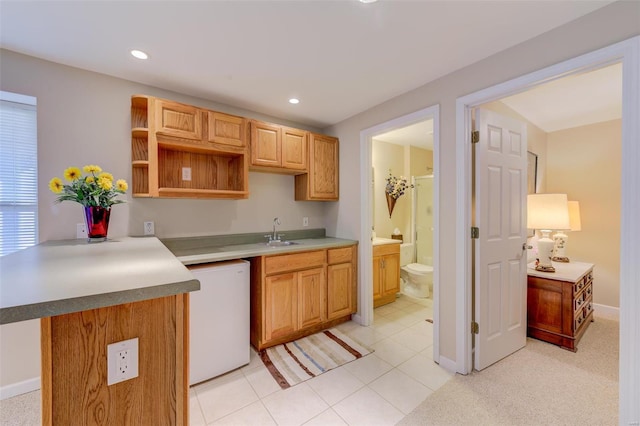 kitchen with a sink, baseboards, dishwasher, recessed lighting, and open shelves