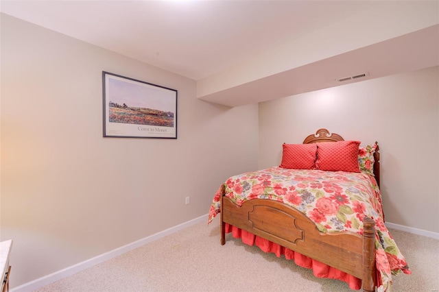 carpeted bedroom with baseboards and visible vents