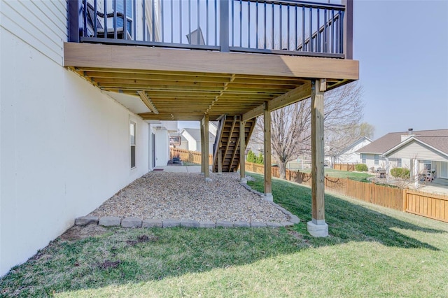 view of yard with stairway and fence