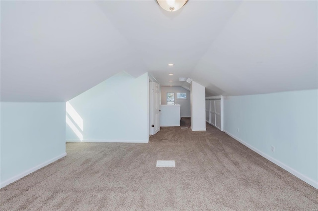 additional living space with lofted ceiling, recessed lighting, baseboards, and carpet floors