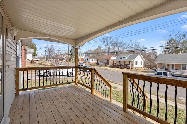 wooden deck with a residential view