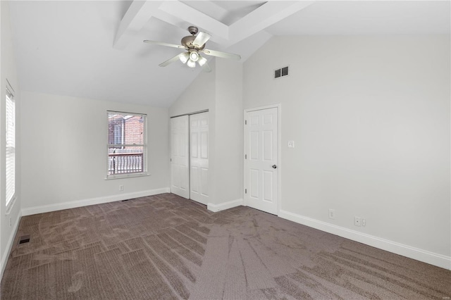 unfurnished bedroom with visible vents, high vaulted ceiling, baseboards, and carpet floors