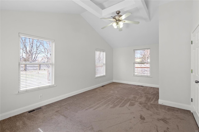 unfurnished bedroom with visible vents, lofted ceiling, carpet, baseboards, and ceiling fan