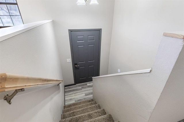 stairway with wood finished floors