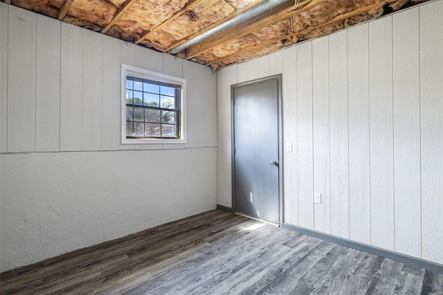 empty room with wood finished floors