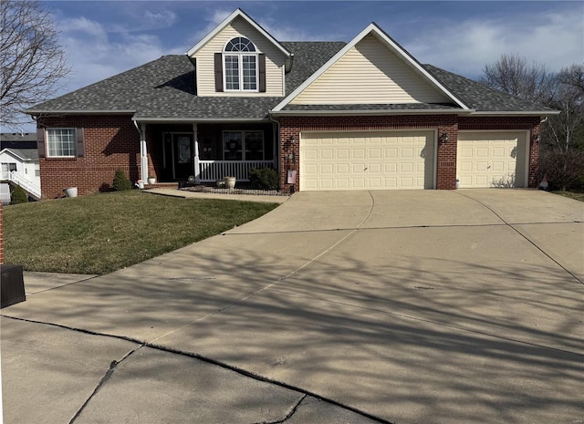 view of front of property featuring driveway, covered porch, a front lawn, a garage, and brick siding