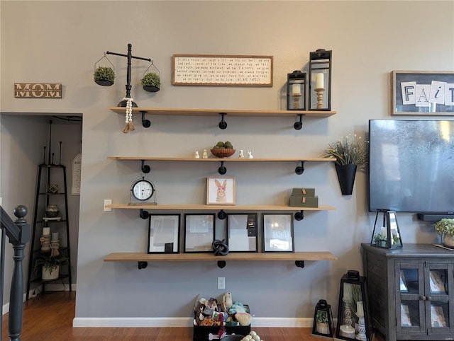 room details with baseboards and wood finished floors