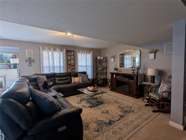 carpeted living area with a textured ceiling