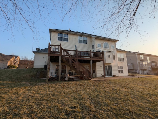 back of house with a patio area, stairway, a lawn, and a deck