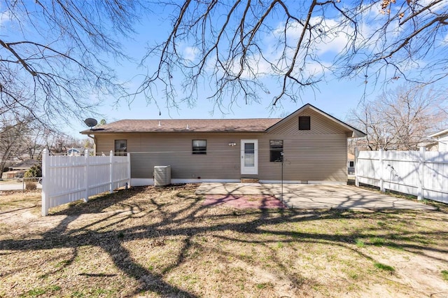 back of house with a patio, cooling unit, fence, and a lawn