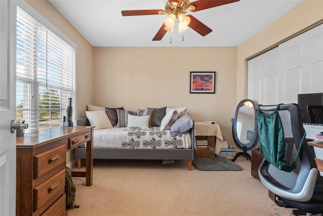 bedroom featuring carpet flooring and a ceiling fan