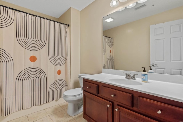 bathroom with visible vents, toilet, a shower with curtain, tile patterned floors, and vanity