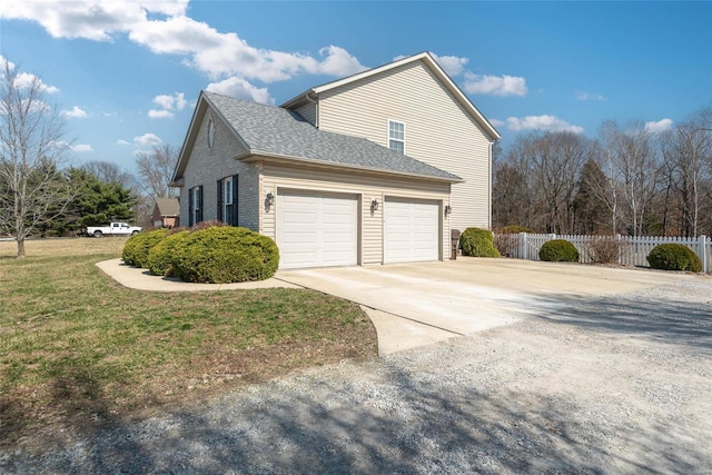 view of home's exterior featuring fence, a yard, roof with shingles, concrete driveway, and brick siding