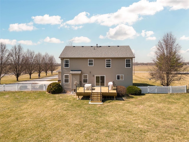 rear view of property with a fenced backyard, a lawn, a deck, and a gate