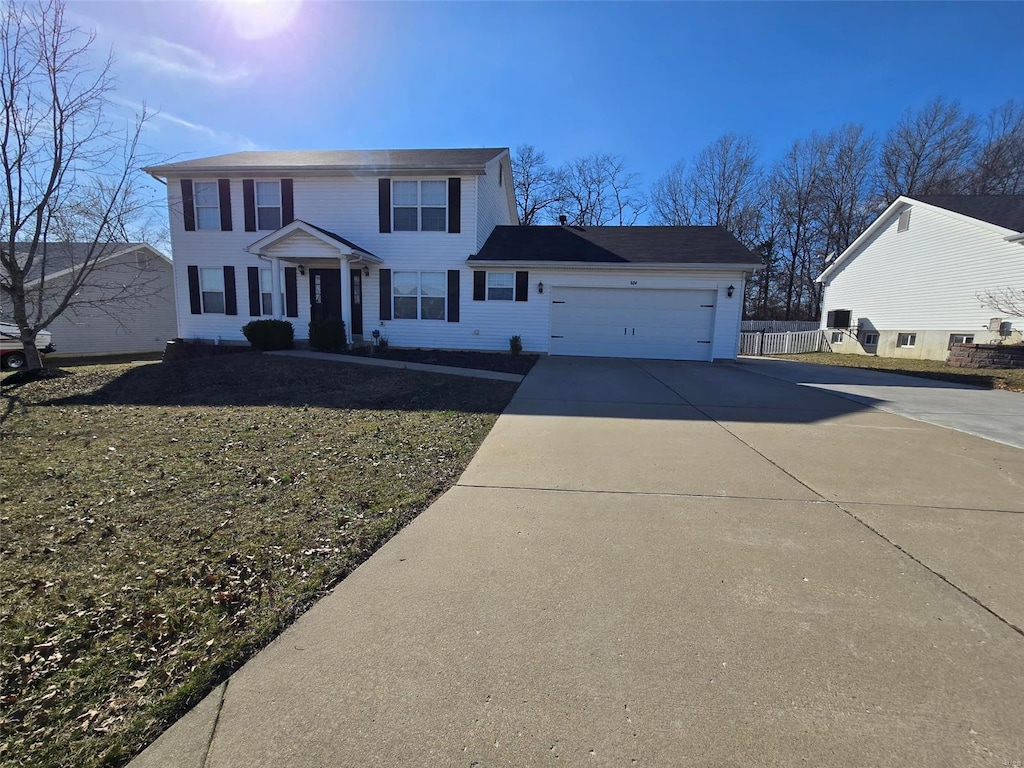 view of front of property featuring driveway and a garage